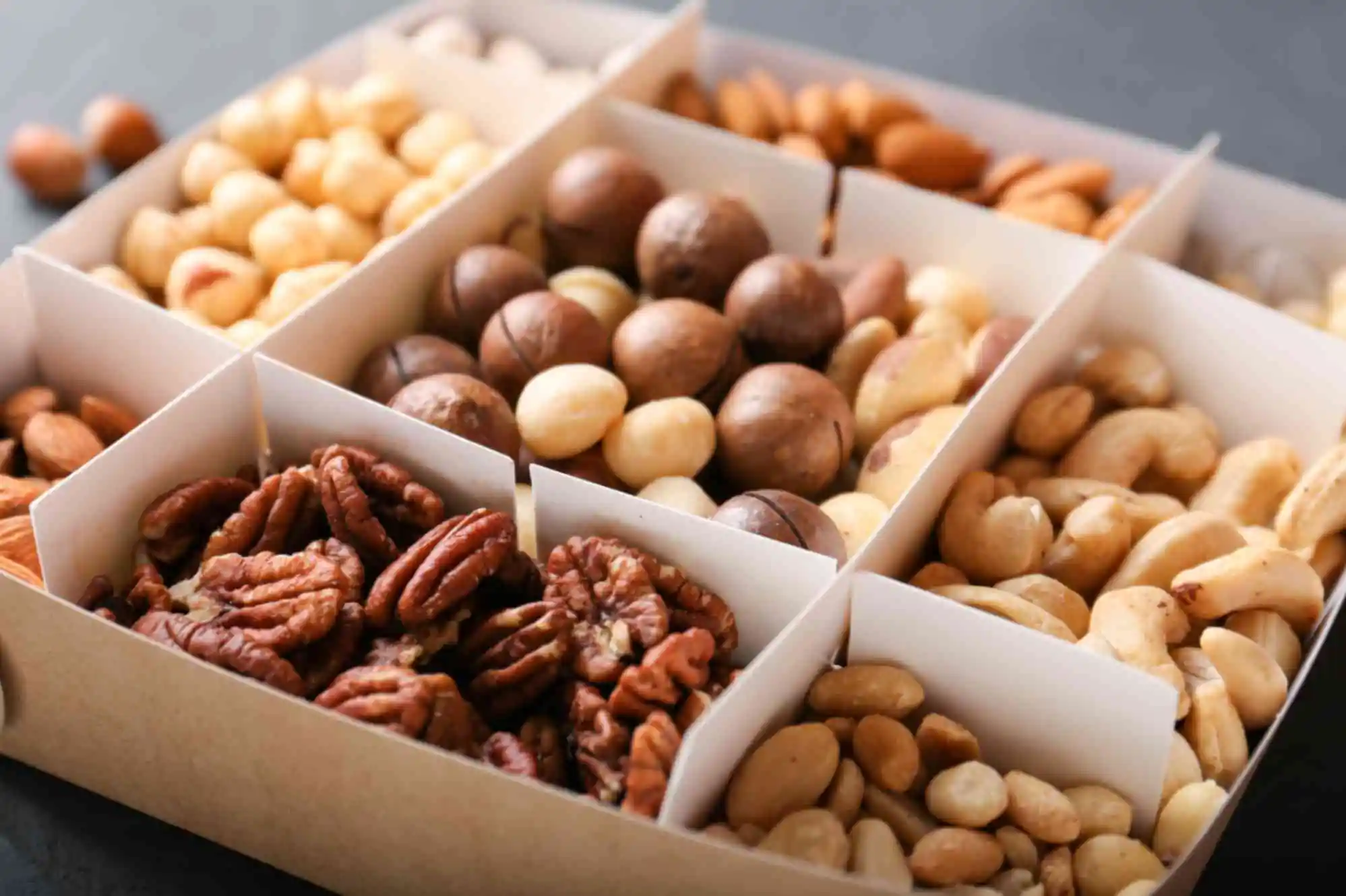 different grade of nuts in a box