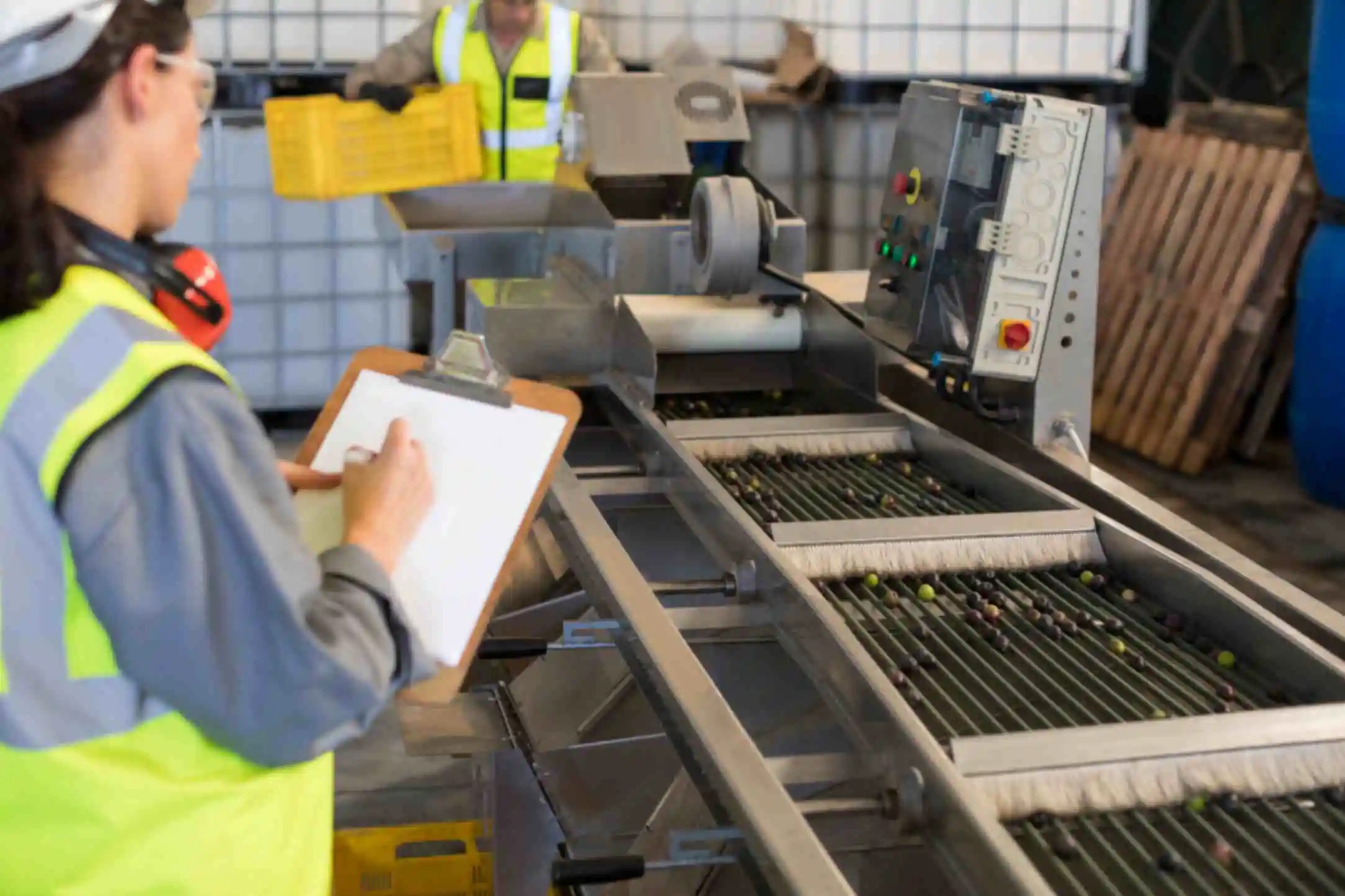 female technician writing on clipboard